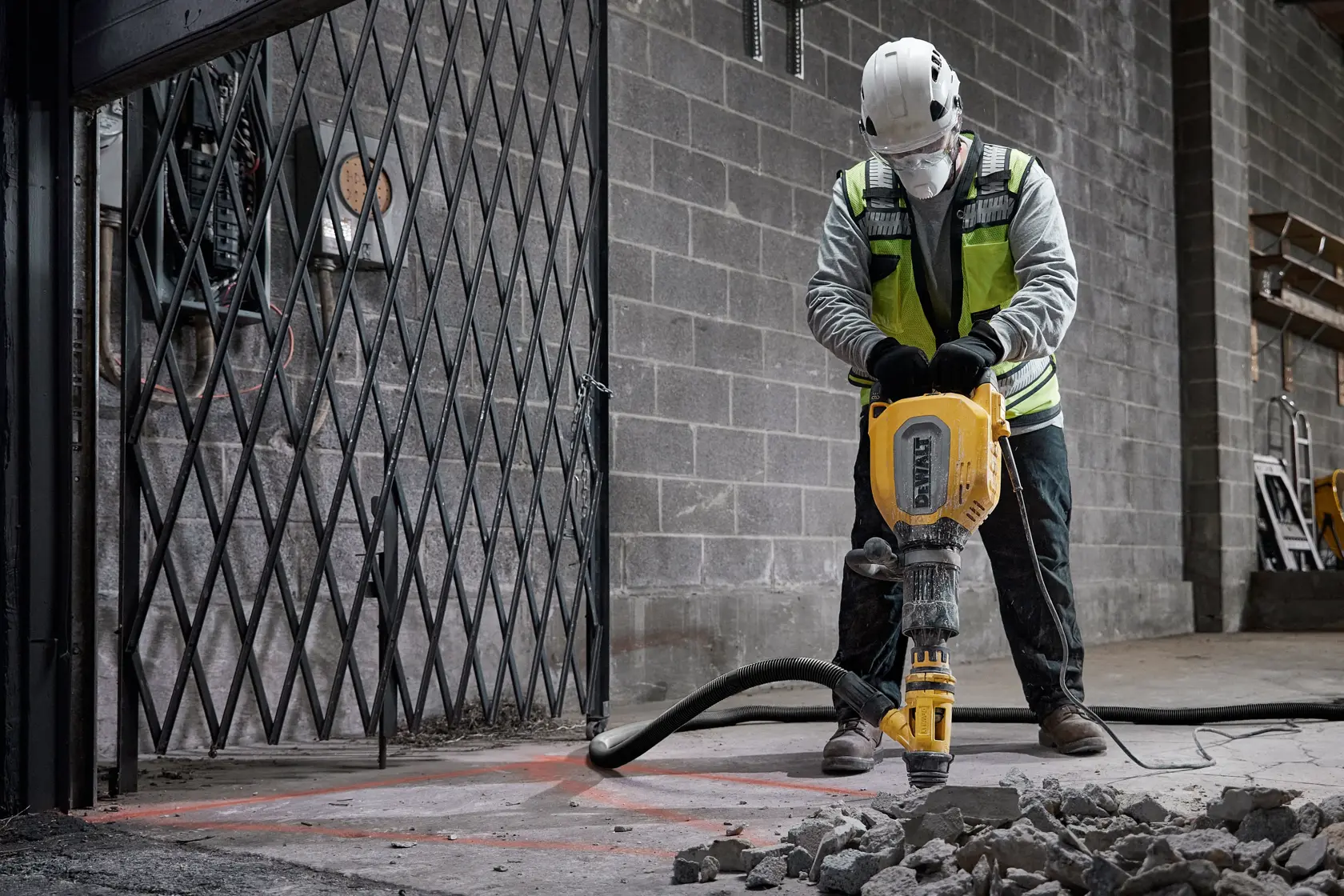 DEWALT electric demolition hammer with yellow and black casing and side handle.