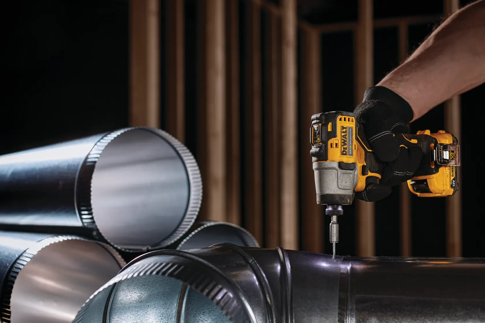 DEWALT DCK2111L2T-XE, DCF801N used to drill metal pipes in construction. Product shown in photography category.