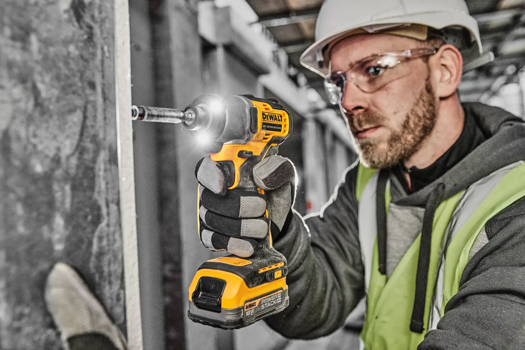 DEWALT DCF840E1T cordless impact driver set, including a black and yellow DEWALT-branded carrying case, the impact driver tool, and a compact Powerstack battery.