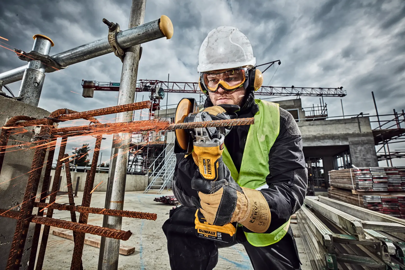 DEWALT DCG406N, DCZ409P2-XE, DCZ401P3-XE, DCG406 tools used for cutting metal at a construction site.