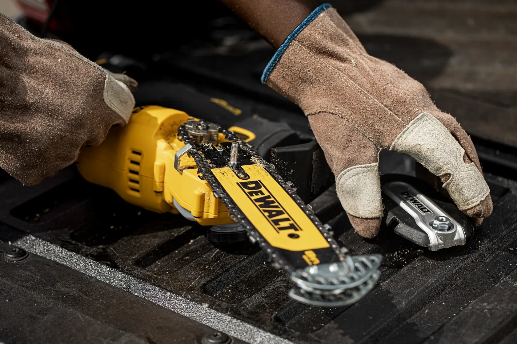 DEWALT 18V XR Brushless cordless compact chainsaw, model DCMPS520N, with a black and yellow body and visible chain bar.