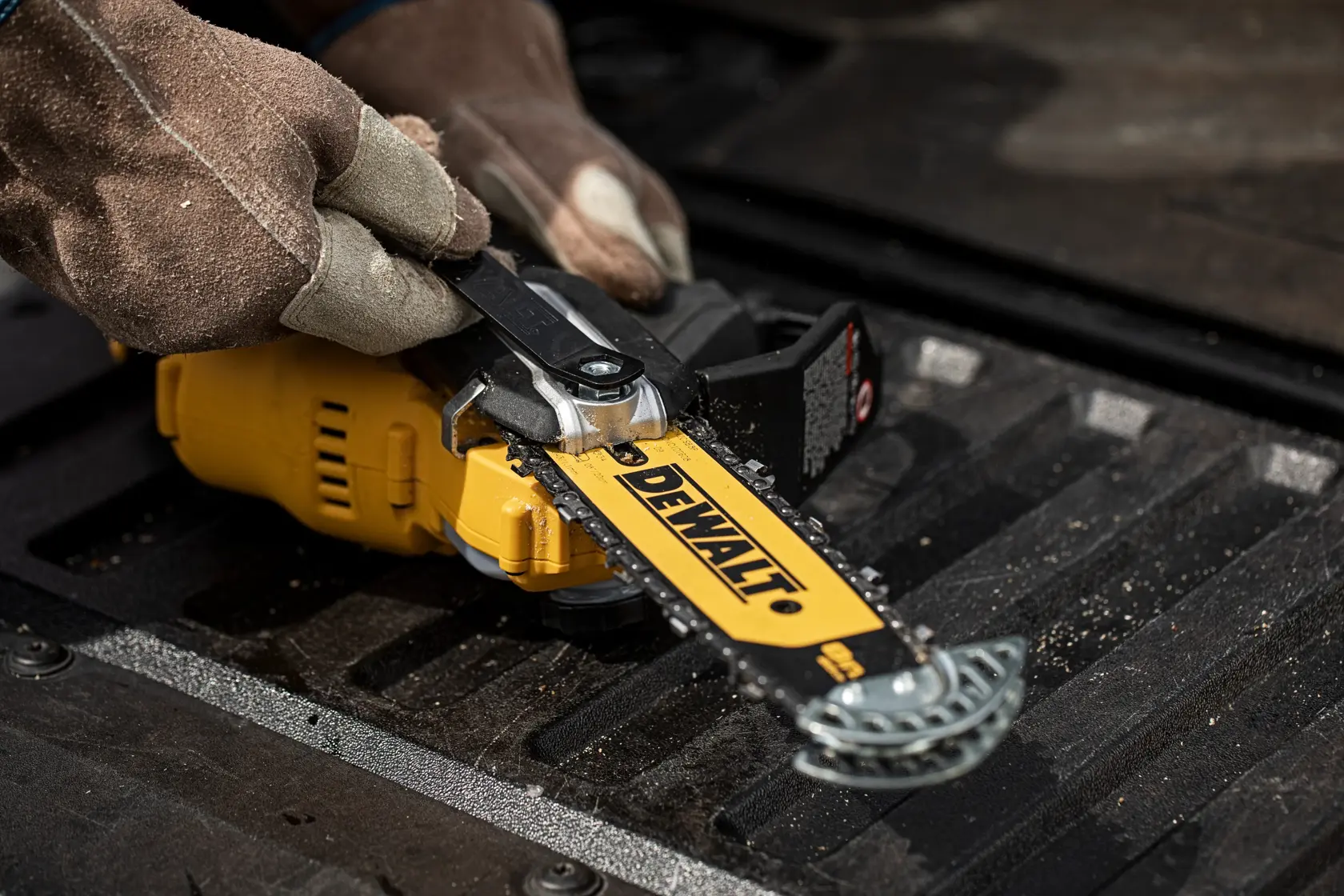 A yellow and black DEWALT cordless 18V XR brushless chainsaw with ergonomic handle and protective hand guard, model DCMPS520N.