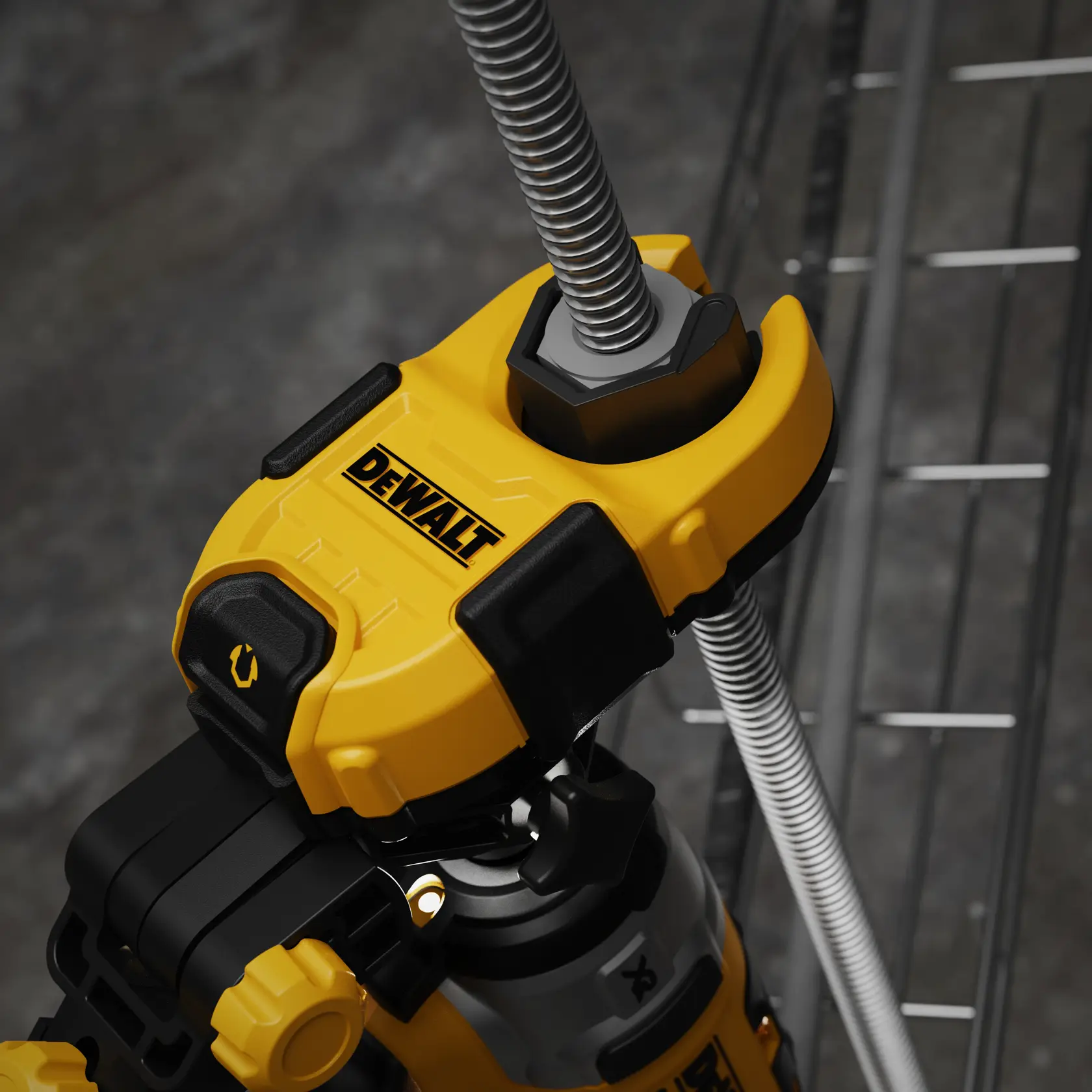 Close-up of DEWALT DT20562 tool gripping a threaded rod. Yellow and black design, industrial background.