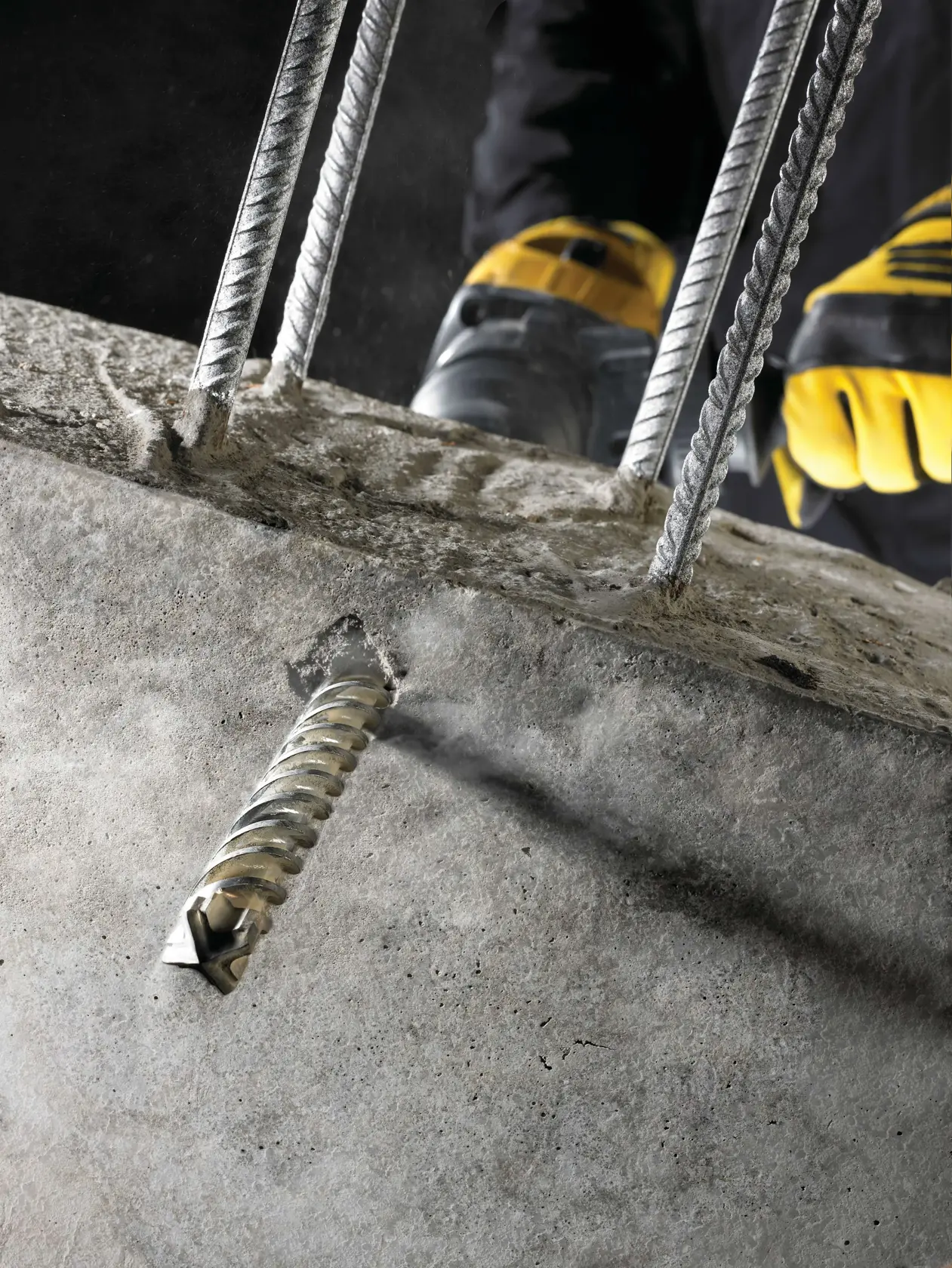 A DEWALT SDS drill bit with spiral design, shown vertically on a plain white background.