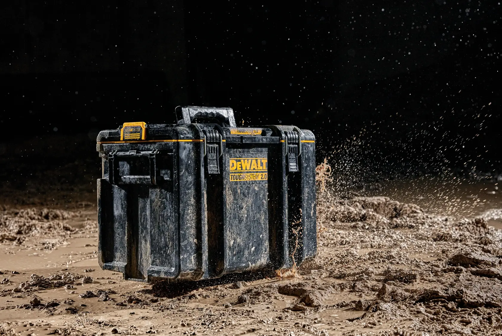 DEWALT ToughSystem 2.0 toolbox in muddy environment, showing durability and water resistance.