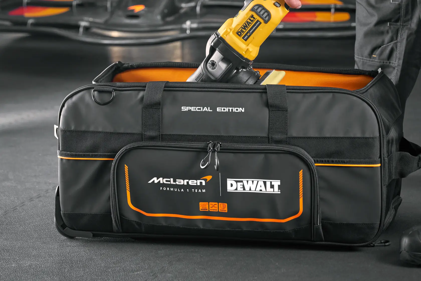DEWALT special edition tool bag with McLaren branding and a yellow power tool inside.