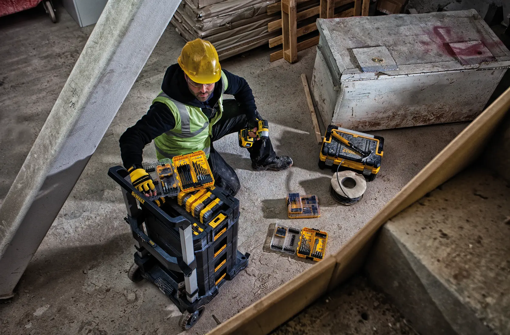 DEWALT DWST83454-1, DWST1-71196, DT70716, DT70758 tool kits used on site by worker. Photography category.
